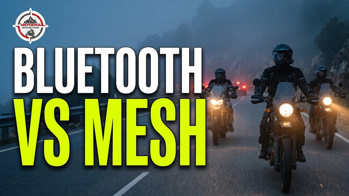 Three motorcyclists riding in a group on a misty mountain highway at dusk with headlights on