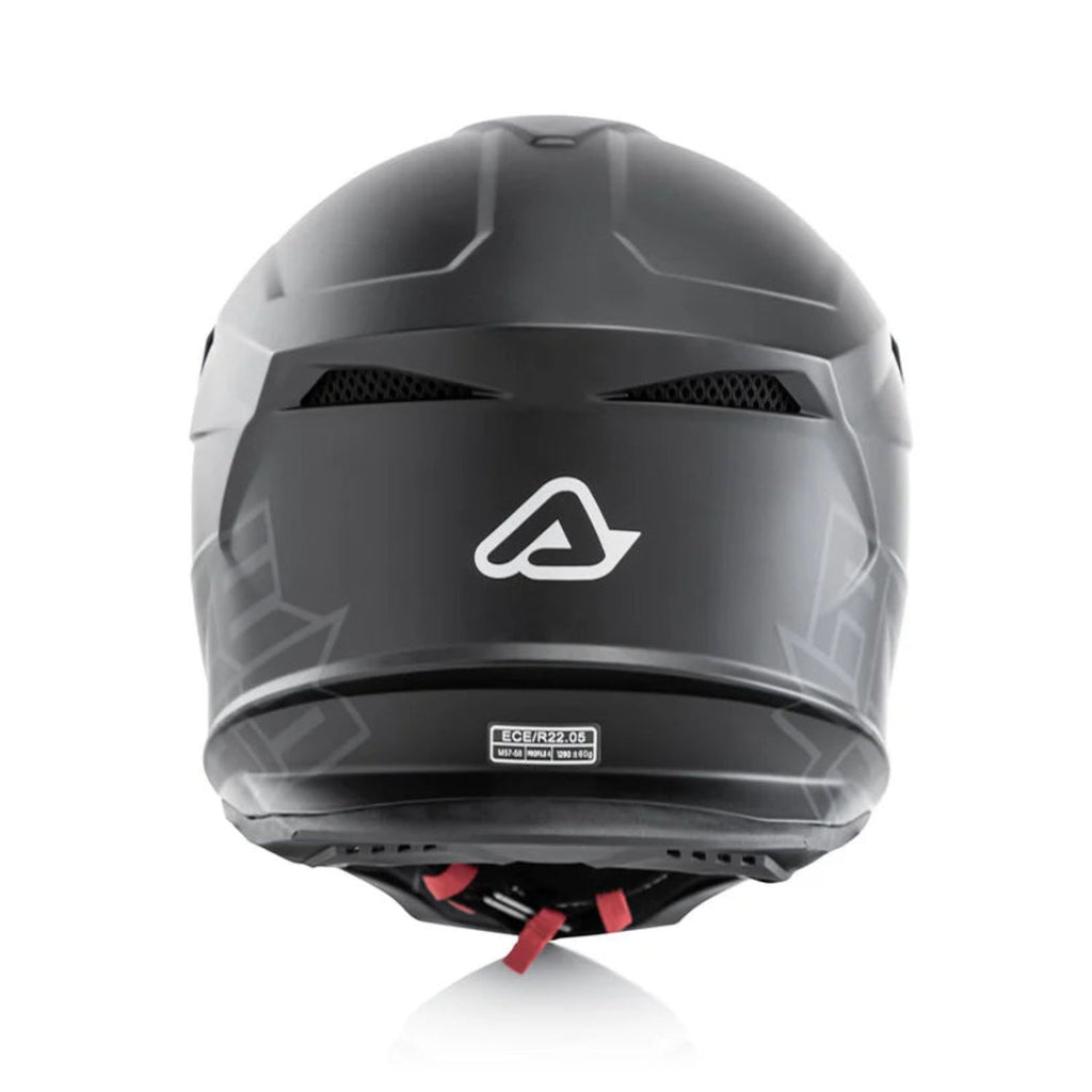 Black motocross helmet rear view with ventilation vents and ECE label, Acerbis logo