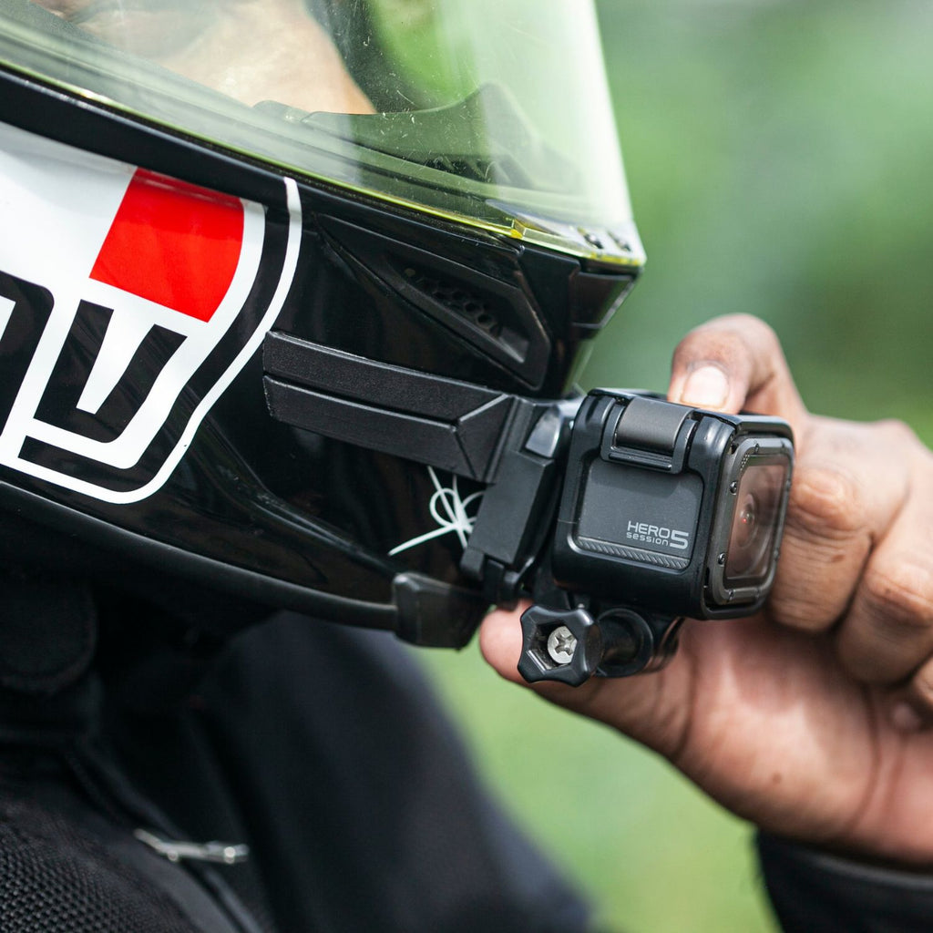 Black chin mount with action camera secured by side clamp and screw