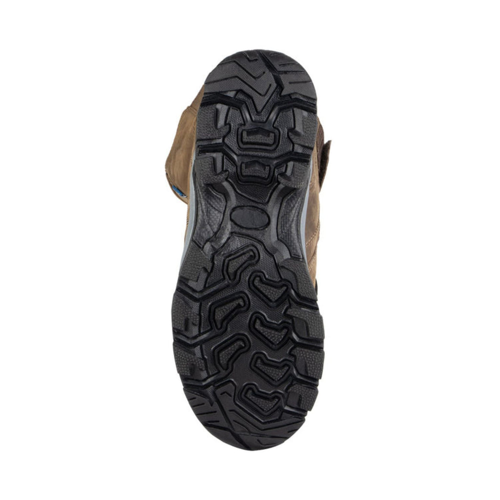 Underside tread of brown riding boots with thick rubber sole for traction