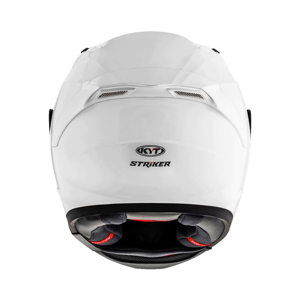 Gloss white helmet rear with vents and STRIKER badge; interior padding visible