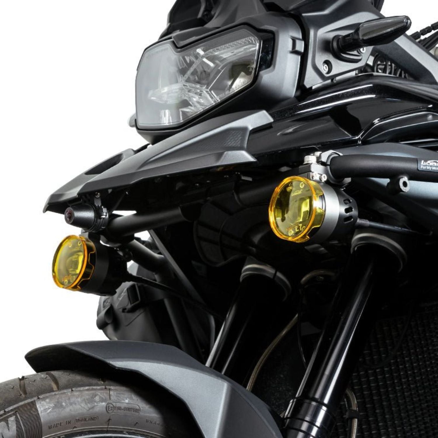 Loboo L75 auxiliary lights on motorcycle, one main yellow lamp and a second smaller one
