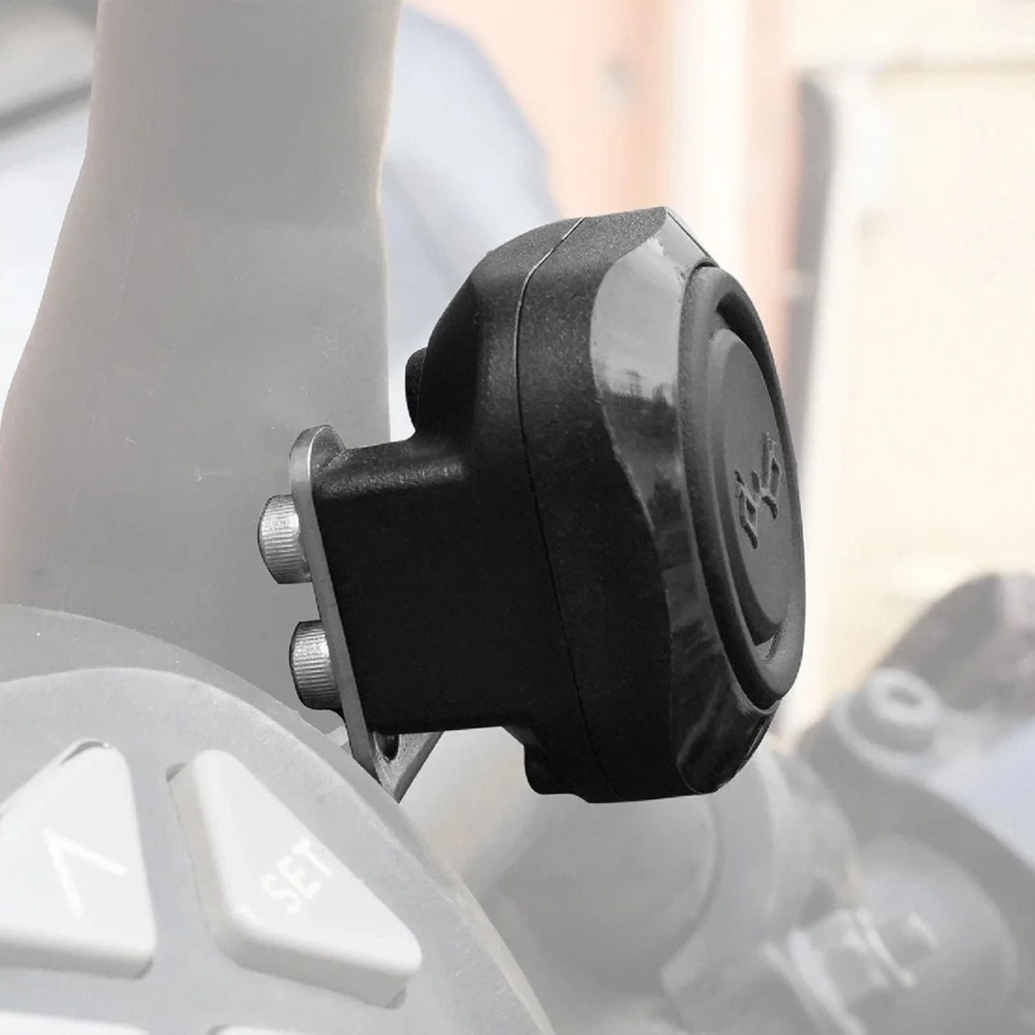 Side view of black switch module on the harness, textured housing
