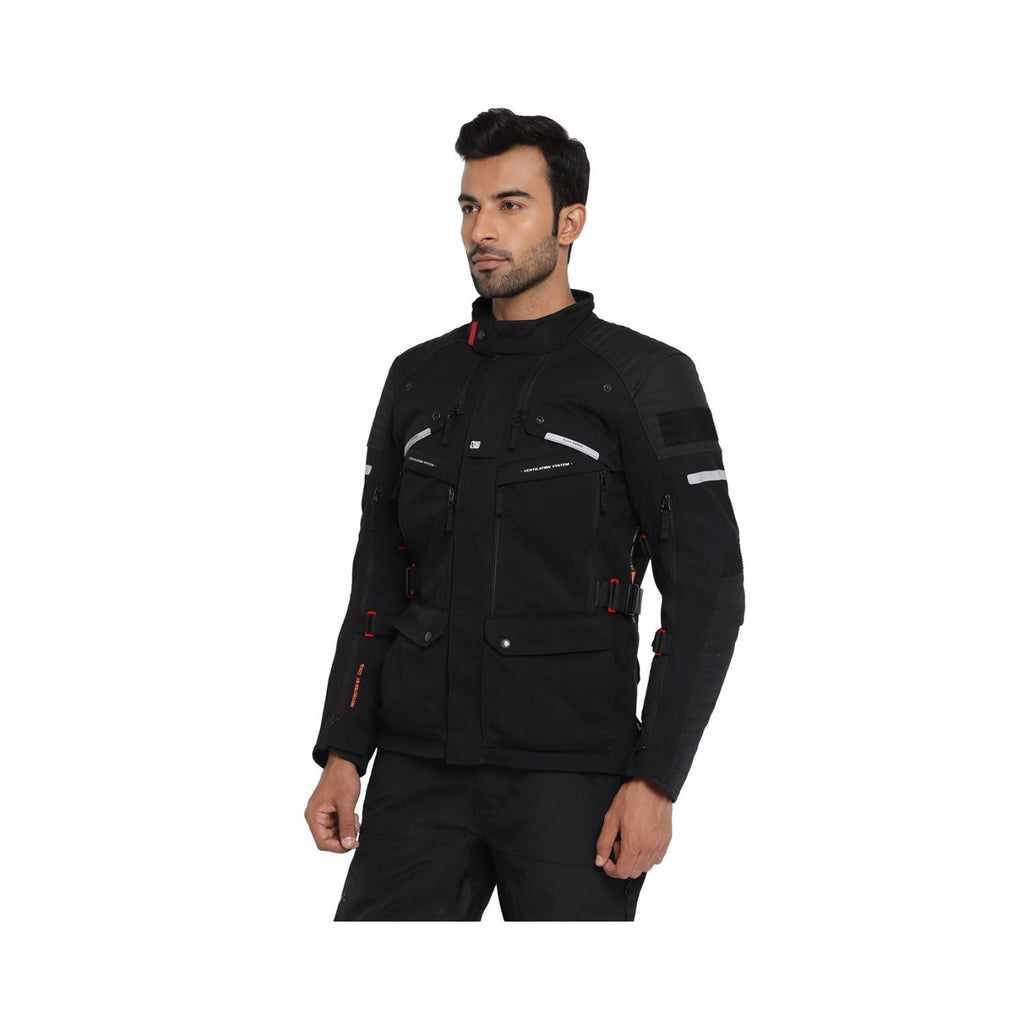 Black Nirvik V2 riding jacket on model, stand collar and chest cargo pockets.