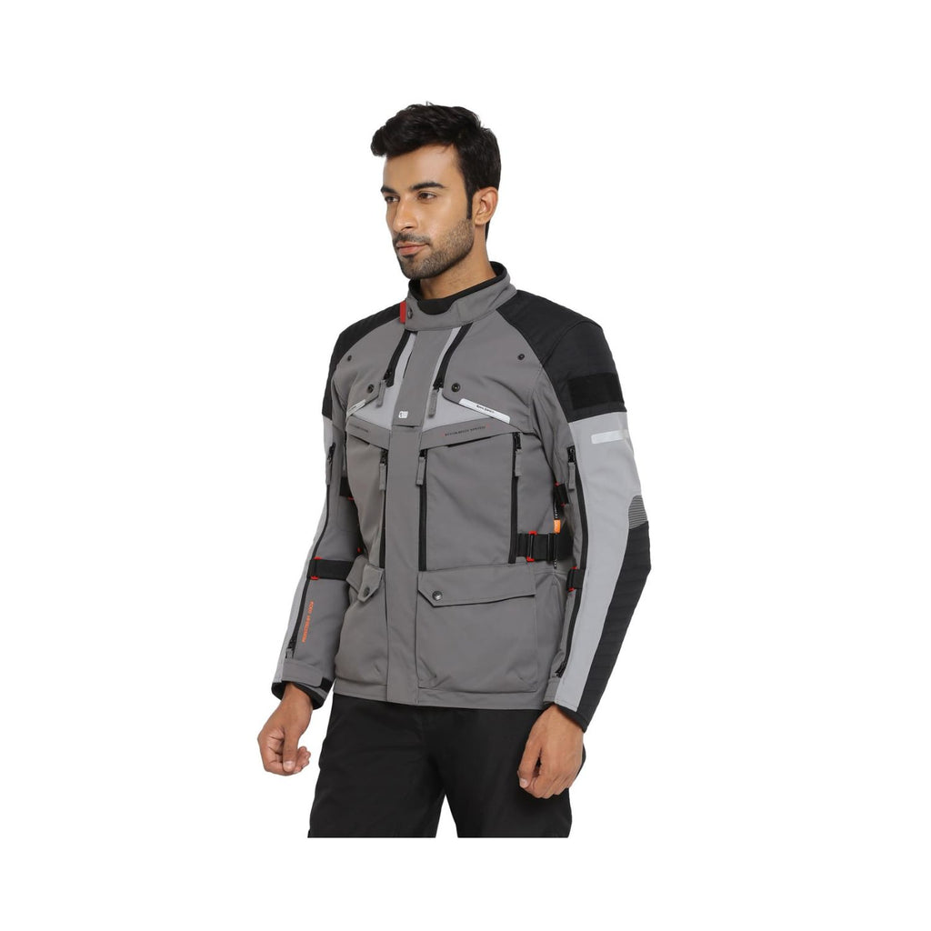 Charcoal Nirvik V2 riding jacket on model, front view with chest pockets and straps