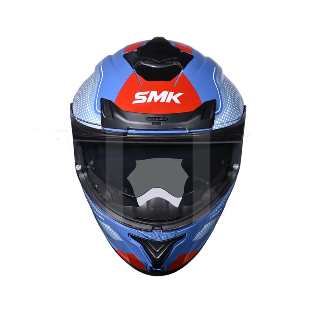 Blue full-face motorcycle helmet with dark visor and red SMK top panel